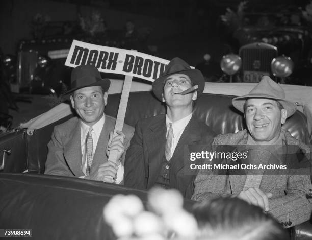 The Marx Bros L-R: Harpo Marx, Groucho Marx, Chico Marx at the Santa Claus Lane Parade circa 1938 in Los Angeles, California.