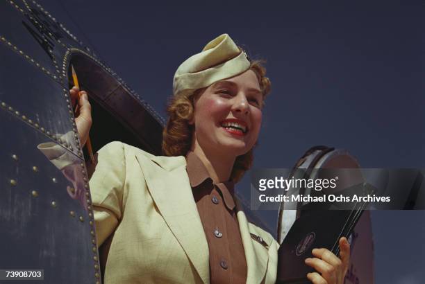 Stewardess exits the plane exits an American Airlines Douglas DC-3 at La Guardia Airport in June 1950 in New York City, New York.