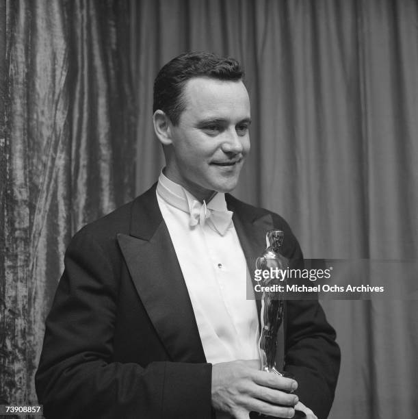March 21 California, Hollywood, RKO Pantages Theatre, Jack Lemmon holding the Academy Award he won for Best Actor in a Supporting Role for his...