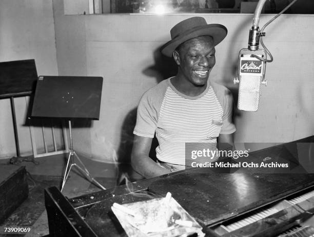 Pianist and singer Nat "King" Cole records at Capitol Records Studios on May 23, 1945 in Los Angeles, California.