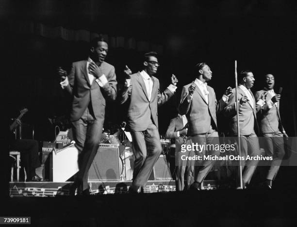 Paul Williams, David Ruffin, Otis Williams, Melvin franklin and Eddie Kendricks of the R&B group "The Temptations" perform onstage at the Apollo...