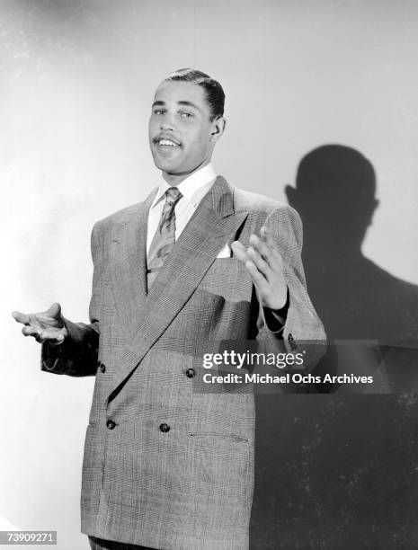 Musician Dexter Gordon poses for a portrait with his saxophone on July 12, 1947 in Los Angeles, California.