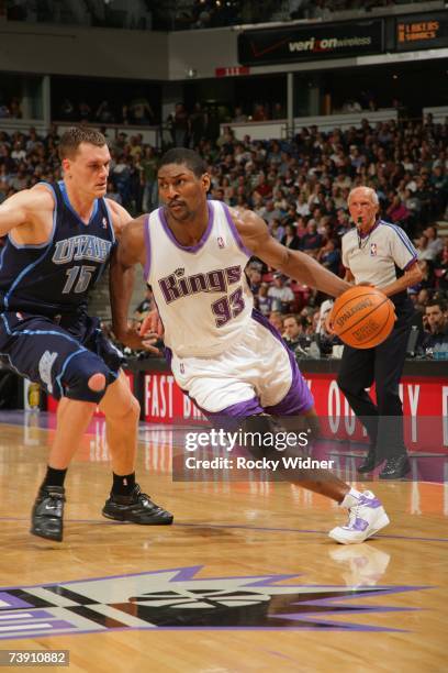 Ron Artest of the Utah Jazz drives past Matt Harpring of the Sacramento Kings during a game at Arco Arena on April 6, 2007 in Sacramento, California....