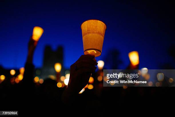 Virginia Tech students take part in a mass candlelight vigil to honor the victims of yesterday's shootings April 17, 2007 in Blacksburg, Virginia....