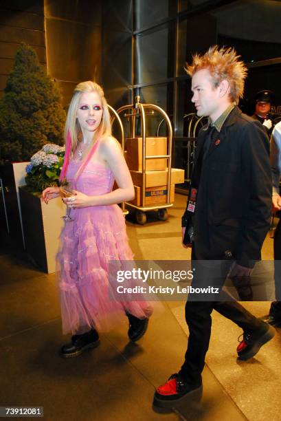 Singer Avril Lavigne and husband Deryck Whibley attend a tribute to the co-founder and chairman of Atlantic Records, Ahmet Ertegun at the Time Warner...