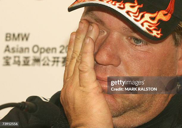 Tired looking John Daly of the US, answers a question at a press conference to promote the BMW Asian Open golf championship in Shanghai 18 April...