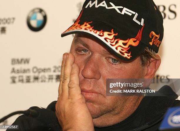 Tired looking John Daly of the US, answers a question at a press conference to promote the BMW Asian Open golf championship in Shanghai 18 April...