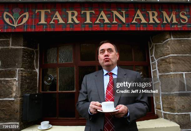 Alex Salmond, leader of the SNP, enjoys a cup of tea on a visit to the Tartan Arms pub on April 18, 2007 in Bannockburn, Scotland. Mr Salmond was...