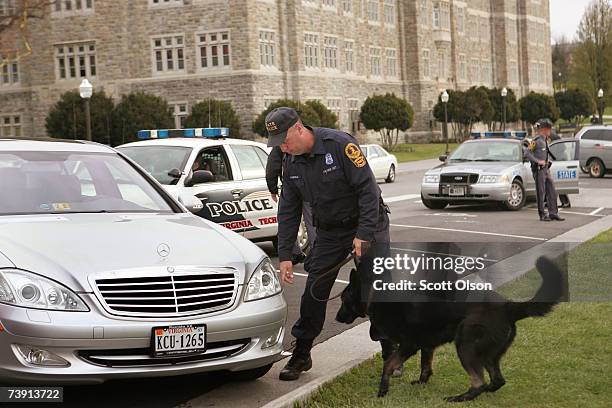 Virginia State Troopers resopnd to a perceived threat at Virginia Tech's Burruss Hall, which sits next to Norris Hall where on Monday a gunman shot...