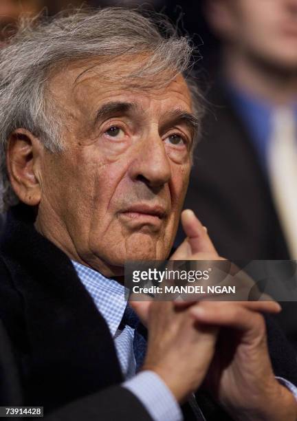 Washington, UNITED STATES: Holocaust survivor and writer Elie Wiesel listens as US President George W. Bush speaks on Darfur during a visit to the...