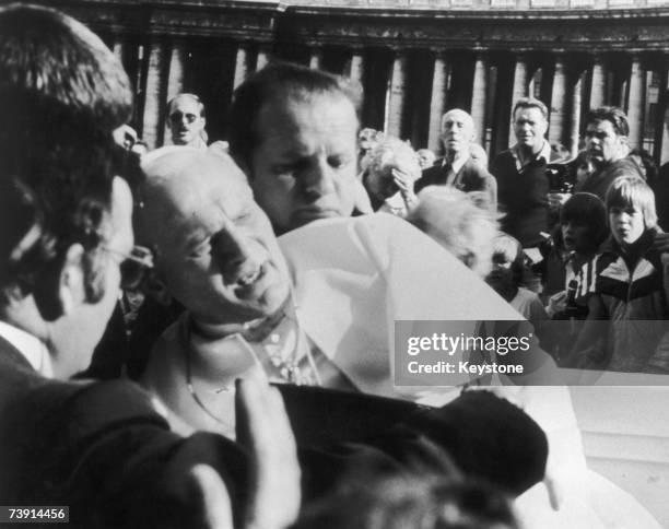 Pope John Paul II in agony after being shot by would-be assassin Mehmet Ali Agca in St Peter's Square, 13th May 1981.