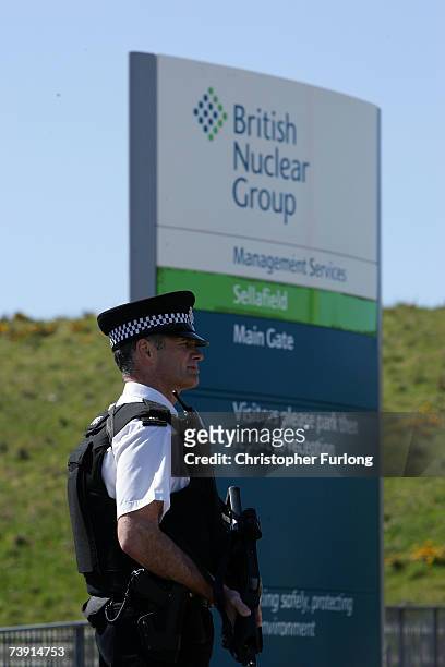 Armed officers from the Civil Nuclear Police guard the main entrance to Sellafield nuclear plant on April 18, 2007 in Sellafield, England. An...