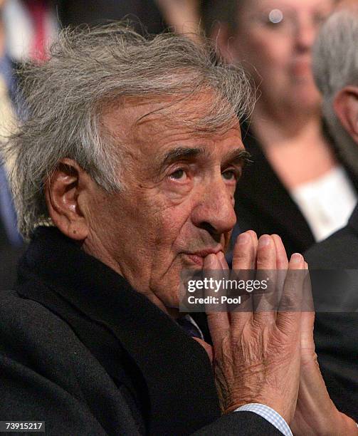 Nobel laureate Elie Weisel listens to a speech by President George W. Bush at the Holocaust Memorial Museum in Washington, DC April 18, 2007 in...