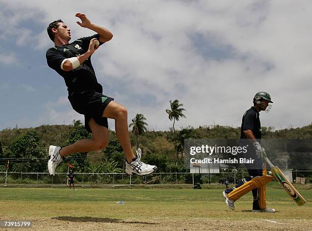 Shaun Tait of Australia bowls with captain Ricky Ponting looking on during training at La Sagesse Cricket Ground on April 18 in St George's, Grenada.