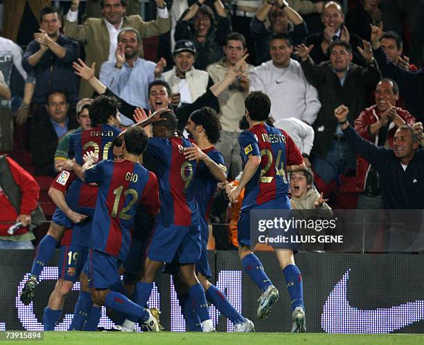 Barcelona's Argentine Leo Messi and his teammates celebrate after scoring the second goal against Getafe during their Spanish King's Cup football...