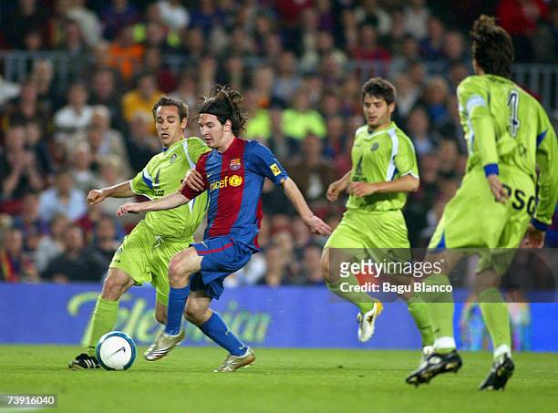 Lionel Messi of Barcelona runs through Getafe players to score during the match between FC Barcelona and Getafe, of Copa del Rey, on April 18 played...