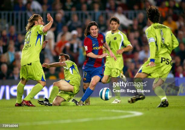 Lionel Messi of Barcelona runs through Getafe players to score during the match between FC Barcelona and Getafe, of Copa del Rey, on April 18 played...
