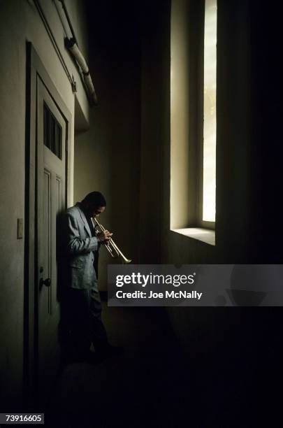 Wynton Marsalis, composer-trumpeter stands in a hallway of the St. Louis Cathedral quietly practicing a melody on January 1989 in St. Louis,...