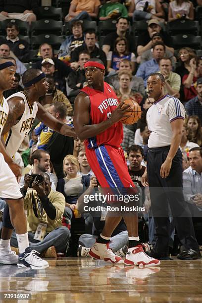 Chris Webber of the Detroit Pistons goes up against Jermaine O'Neal of the Indiana Pacers during the game at Conseco Fieldhouse on April 3, 2007 in...