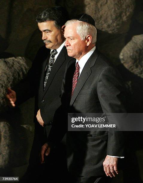 Defense Secretary Robert Gates walks alongside his Israeli counterpart Amir Peretz 19 April 2007 during a visit to the Yad Vashem Holocaust museum in...