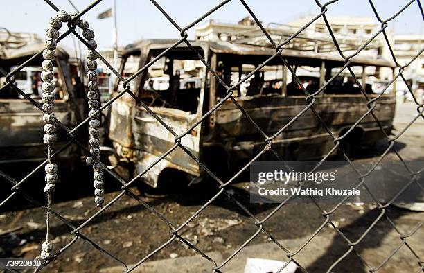 Beads are attached to a fence at the site of the devastating Sadriya market bombing on April 19, 2007 in Baghdad, Iraq. At least 127 people were...