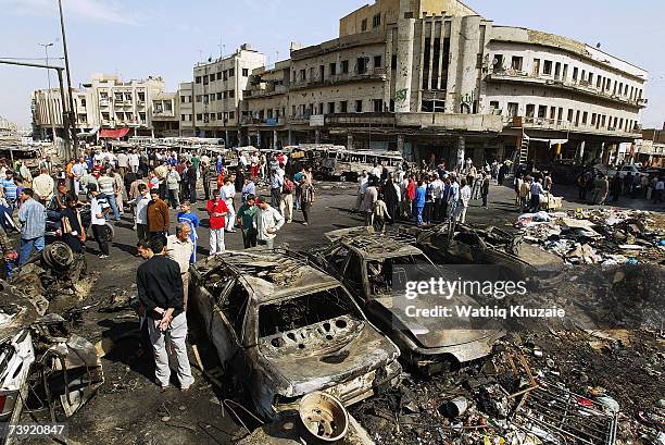 Iraqis gather at the site of the devastating Sadriya market bombing on April 19, 2007 in Baghdad, Iraq. At least 127 people were killed and 148...