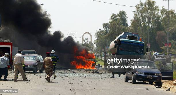 Cars burn at the site of a suicide car bomb explosion in the Jadriya neighborhood on April 19, 2007 in Baghdad, Iraq. A suicide car bomber rammed...