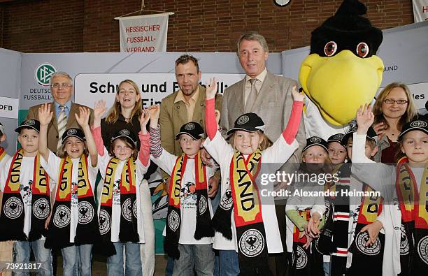 President Theo Zwanziger, footballplayer Nia Kuenzer, goalkeeper Markus Proell and DFB vice president Rolf Hocke pose with kids during the DFB School...