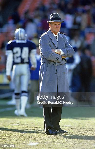 Head Coach Tom Landry of the Dallas Cowboys stands on the field prior to a game against the Washington Redskins on December 13, 1987 in Washington,...