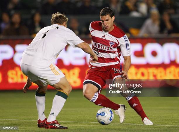 Ty Harden of the Los Angeles Galaxy defends Kenny Cooper of FC Dallas during their MLS match at The Home Depot Center on April 12, 2007 in Carson,...