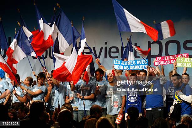 Supporters attend the last campaign meeting of Nicolas Sarkozy, head of the right-of-centre French conservative party UMP and candidate for the...