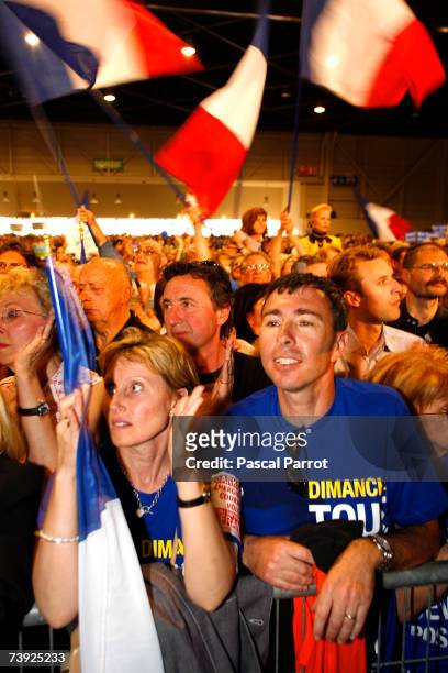 Supporters attend the last campaign meeting of Nicolas Sarkozy, head of the right-of-centre French conservative party UMP and candidate for the...
