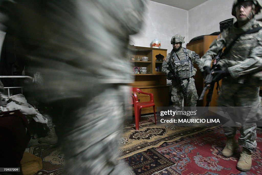 US troops leave a room after a sweep dur...