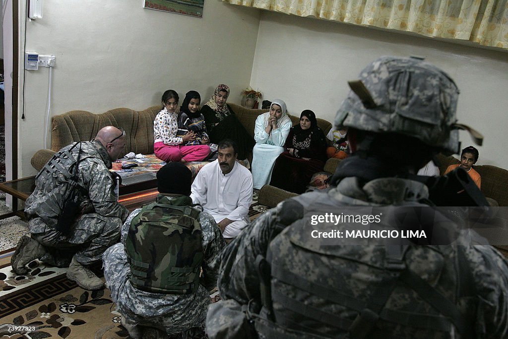 An Iraqi man listens to a interpreter (2...