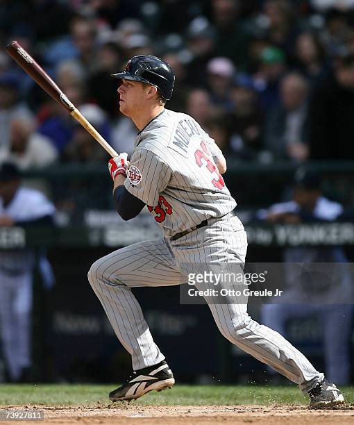 Justin Morneau of the Minnesota Twins singles against the Seattle Mariners on April 19, 2007 at Safeco Field in Seattle, Washington. The Twins...