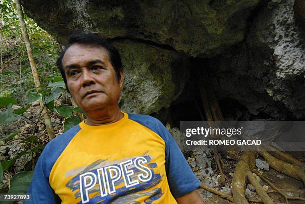 Siquijor, PHILIPPINES: TO GO WITH STORY: PHILIPPINES-MAGIC-WITCHCRAFT-SORCERER by Karl Wilson Filipino sorcerer Alberto 'Edol' Baroro walks out of a...