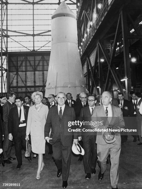 French President Georges Pompidou and his wife, Claude visiting the Kennedy Space Center in Florida, USA, 26th February 1970. Behind them is part of...