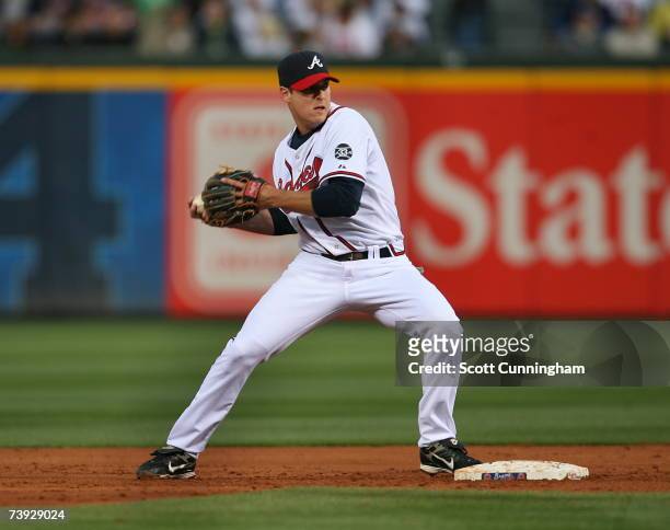 Kelly Johnson of the Atlanta Braves turns a double play against the Chicago Cubs at Turner Field on April 19, 2007 in Atlanta, Georgia. The Cubs...