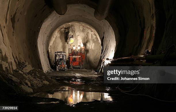 Giant drill makes drillholes to be filled with explosives at the construction site for the Gotthard Base Tunnel on April 19, 2007 near Sedrun,...