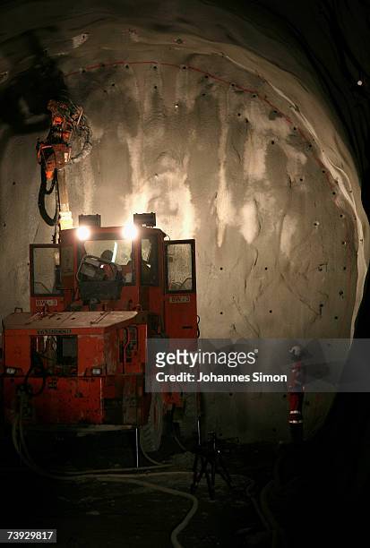 Giant drill prepares drillholes to be filled with explosives at the construction site for the Gotthard Base Tunnel on April 19, 2007 near Sedrun,...
