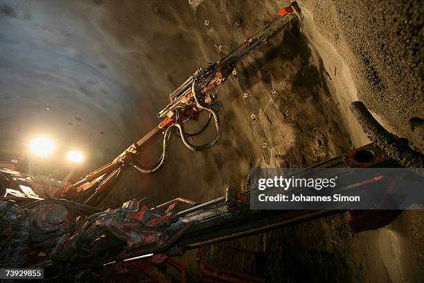 Giant drill prepares drillholes to be filled with explosives at the construction site for the Gotthard Base Tunnel on April 19, 2007 near Sedrun,...