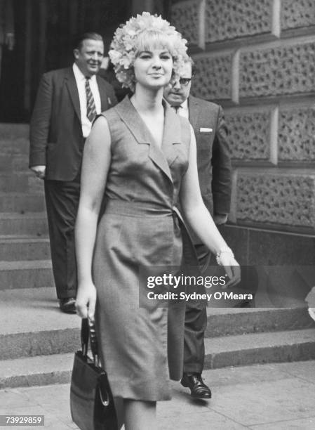 Welsh model and showgirl Mandy Rice-Davies leaves the Old Bailey law court in London, after giving evidence in the Stephen Ward trial, 23rd July 1963.