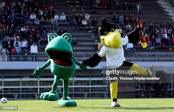 Mascot Guenther of the Tigerentenclub and mascot Paule of the natinal team dancing infront of the men's U15 international friendly match between...