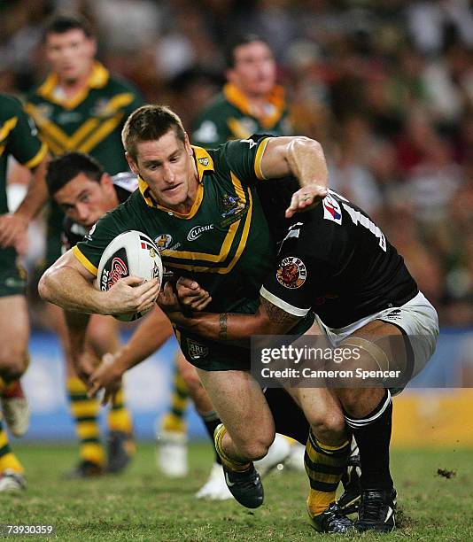 Brent Tate of the Kangaroos is tackled during the ARL Bundaberg Test match between the Australian Kanagroos and the New Zealand Kiwis at Suncorp...