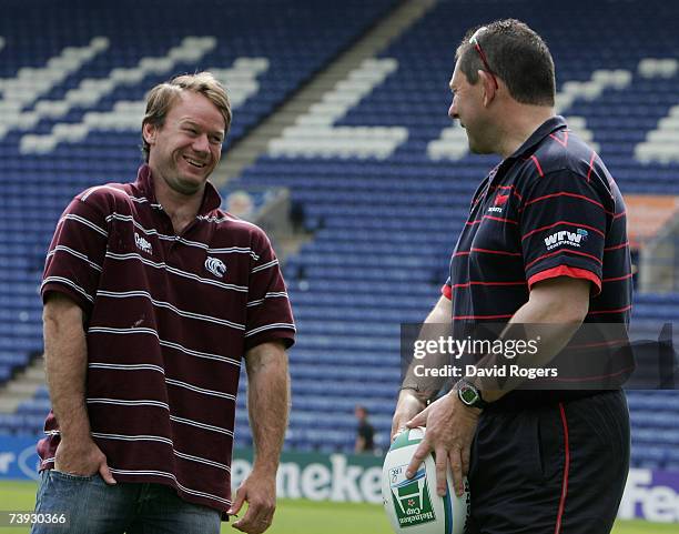 Pat Howard, the Leicester Tigers Head Coach chats with Llanelli Director of Rugby Phil Davies at the Heineken Cup preview media day held at the...