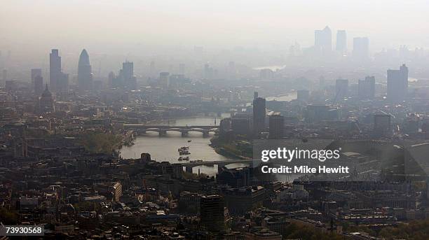 Air pollution hangs over the heart of London in this view along the River Thames towards the city on April 20, 2007 in London, England.