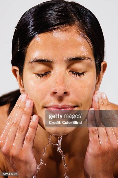 woman washing face, head and shoulders - blind white background stock pictures, royalty-free photos & images