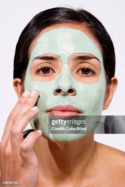 woman with face pack on, portrait - blind white background stock pictures, royalty-free photos & images