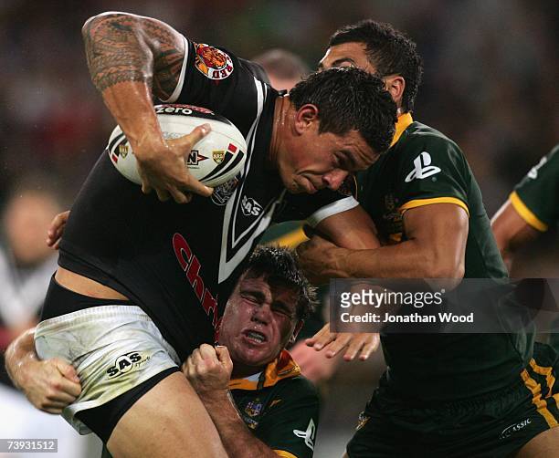 Sonny Bill Williams of the Kiwis is tackled during the ARL Bundaberg Test match between the Australian Kangaroos and the New Zealand Kiwis at Suncorp...