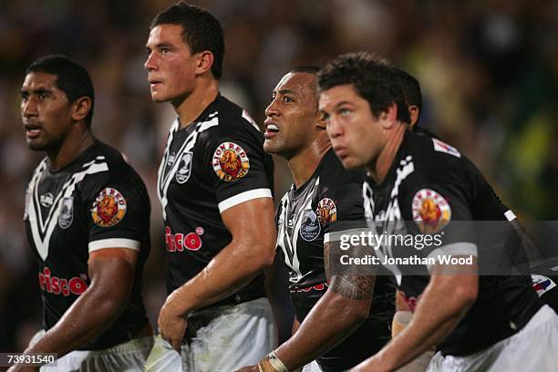 Roy Asotasi of the Kiwis watches on as Johnathan Thurston of the Kangaroos converts a try during the ARL Bundaberg Test match between the Australian...